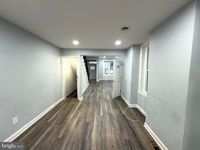 a bathroom with a sink toilet and mirror