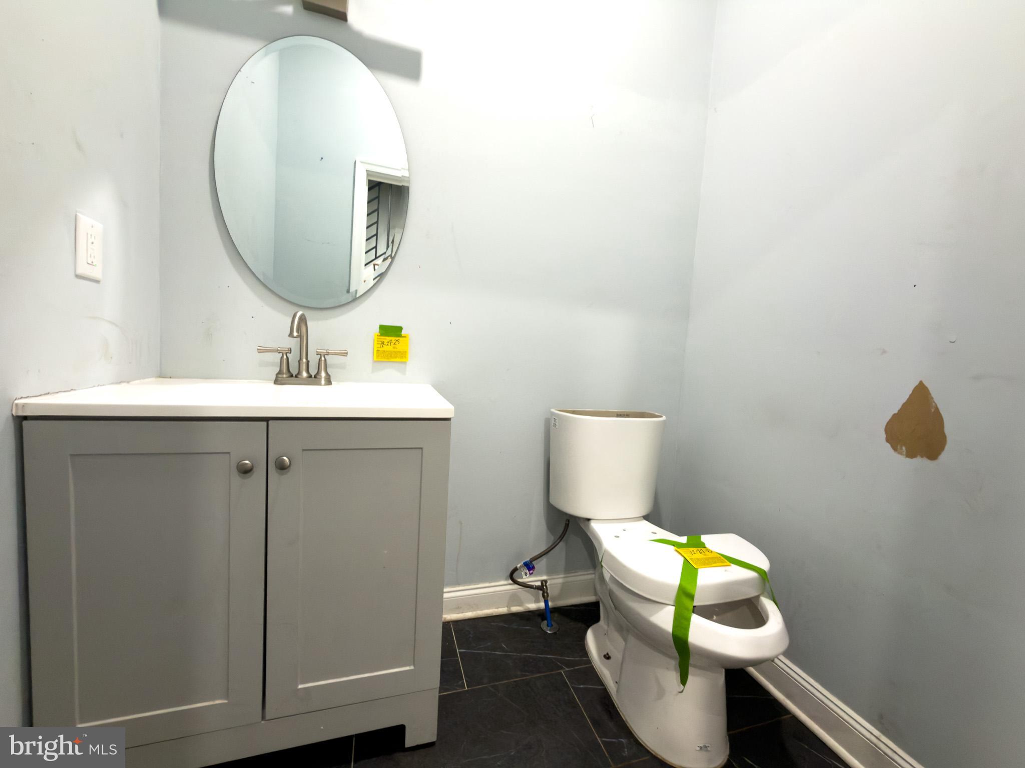 1848 North 27th Street Philadelphia, PA 19121 - Photo 12 of 29 a bathroom with a sink toilet and mirror