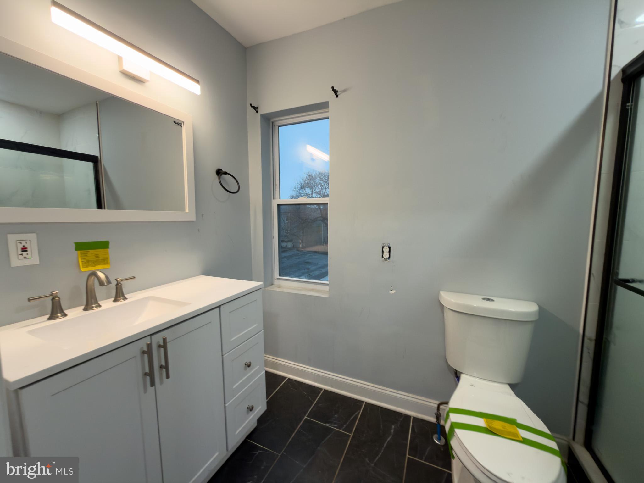 1848 North 27th Street Philadelphia, PA 19121 - Photo 18 of 29 a bathroom with a sink toilet and mirror