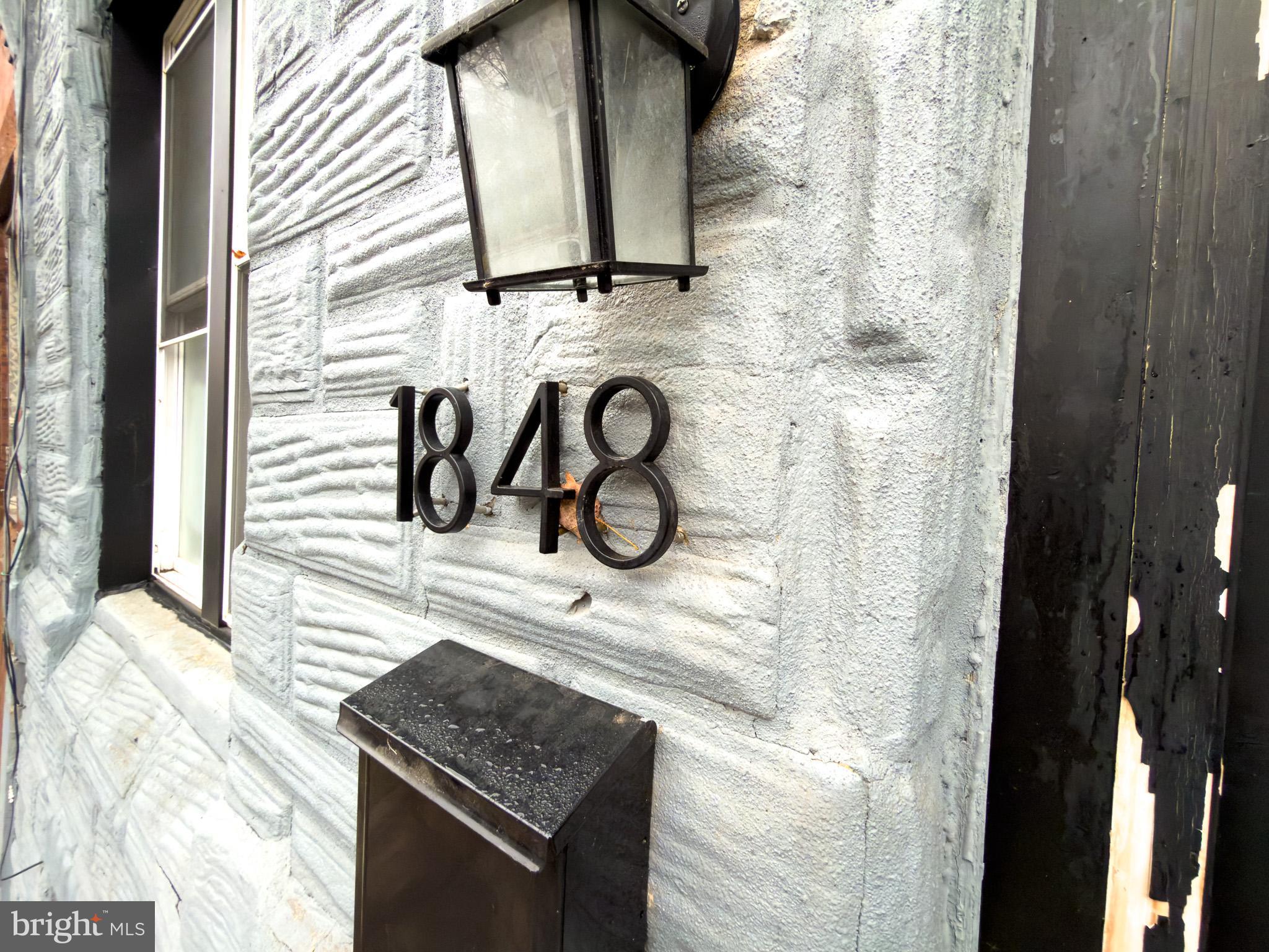 1848 North 27th Street Philadelphia, PA 19121 - Photo 25 of 29 a bathroom with a granite countertop sink and a mirror