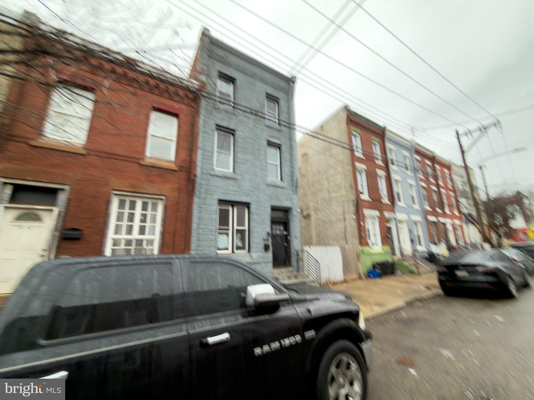 1848 North 27th Street Philadelphia, PA 19121 - Photo 27 of 29 a car parked in front of a brick building