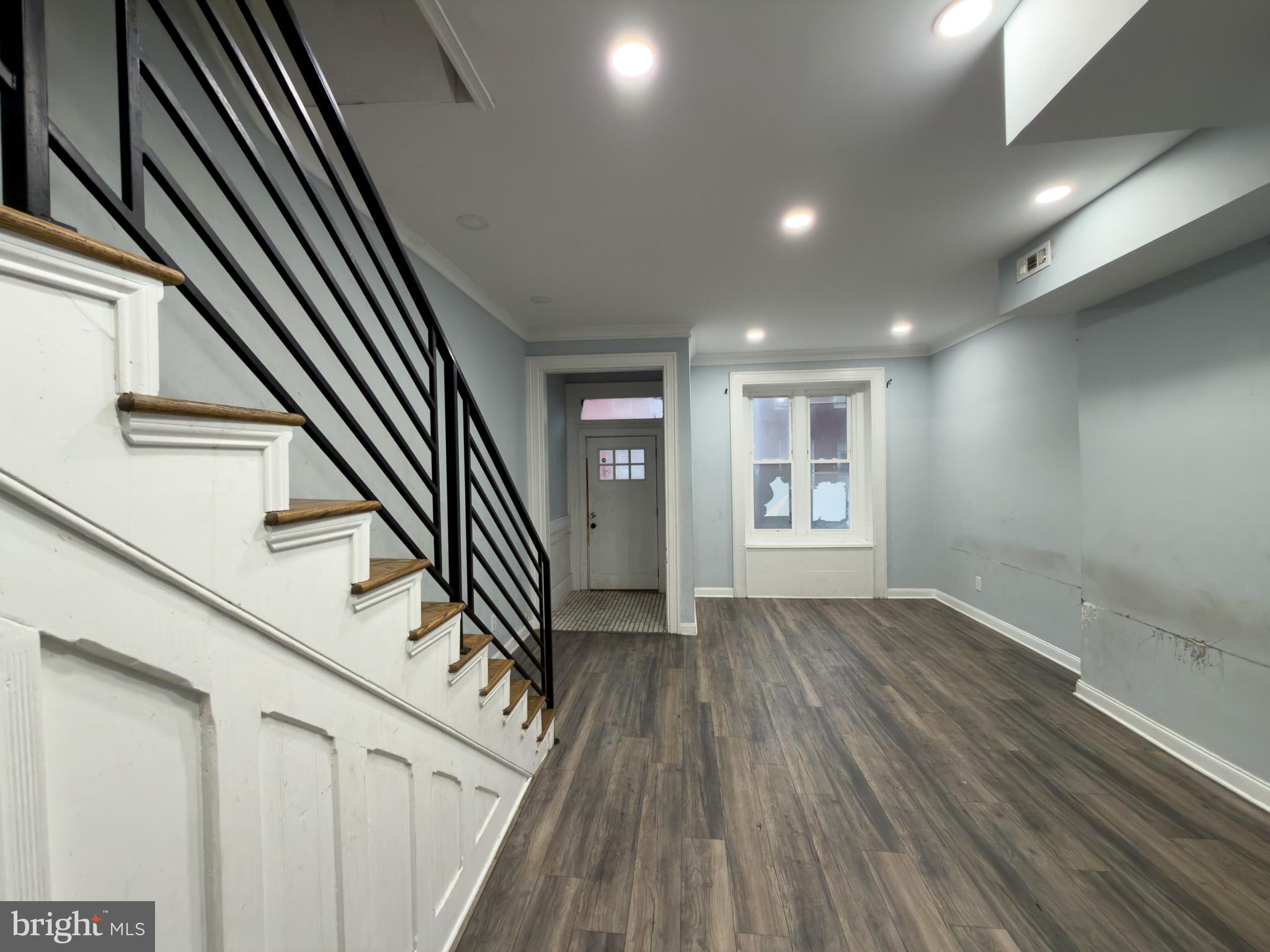 1848 North 27th Street Philadelphia, PA 19121 - Photo 4 of 29 wooden floor in an empty room with a window