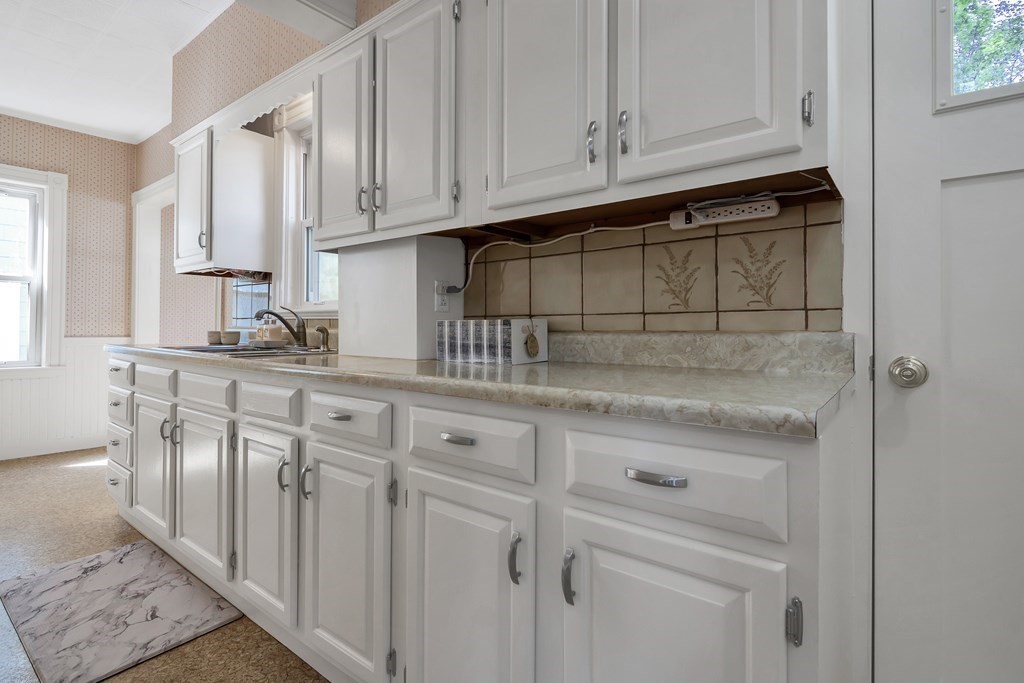 20 Usher Road Medford, MA 02155 - Photo 11 of 42 a kitchen with stainless steel appliances granite countertop white cabinets and a sink