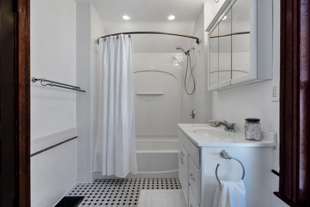 20 Usher Road Medford, MA 02155 - Photo 25 of 42 a bathroom with a sink a toilet and shower