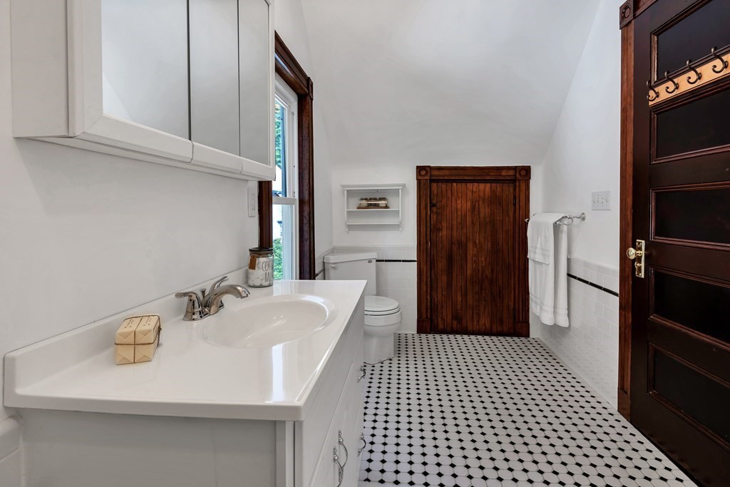 20 Usher Road Medford, MA 02155 - Photo 27 of 42 a bathroom with a sink a toilet and shower