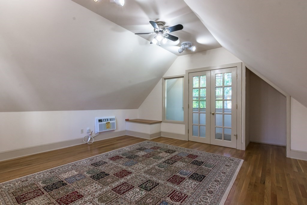 20 Usher Road Medford, MA 02155 - Photo 35 of 42 a view of a livingroom with a ceiling fan and wooden floor