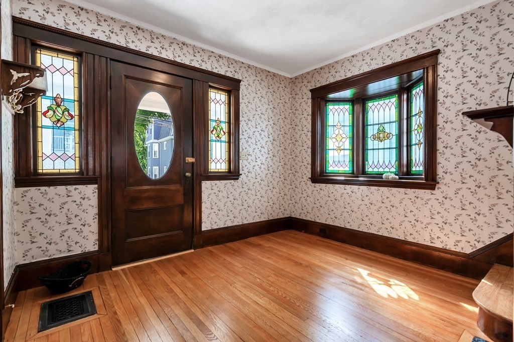 20 Usher Road Medford, MA 02155 - Photo 4 of 42 an empty room with windows