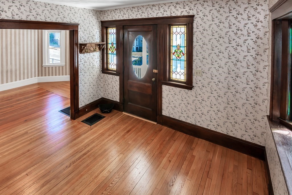 20 Usher Road Medford, MA 02155 - Photo 6 of 42 a view of an entryway with wooden floor and door
