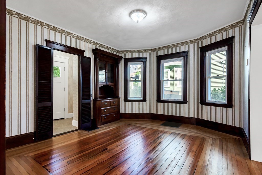20 Usher Road Medford, MA 02155 - Photo 10 of 42 wooden floor in an empty room with a window