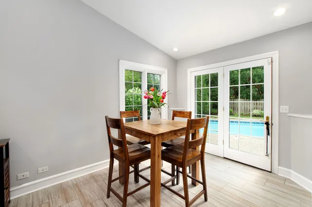a view of a dining room with furniture window and outside view