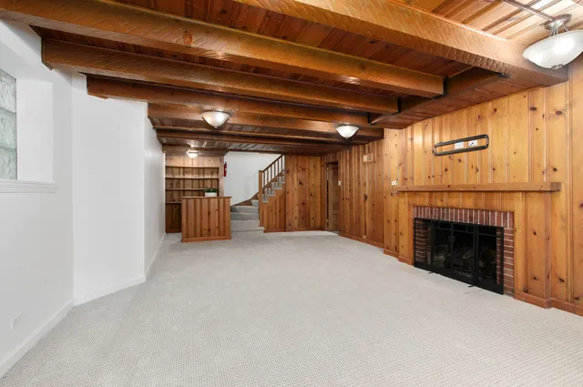 a view of empty room with a fireplace