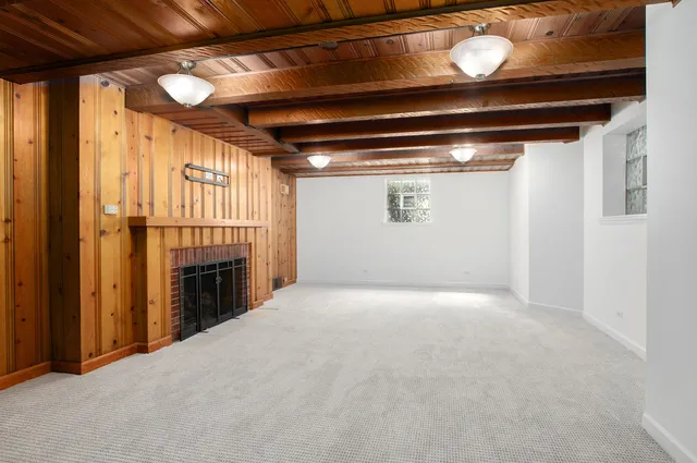 a view of empty room with a fireplace