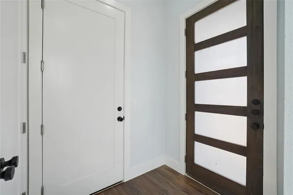 a view of entryway with wooden floor