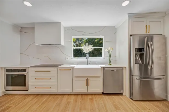 a bathroom with a sink mirror vanity and toilet