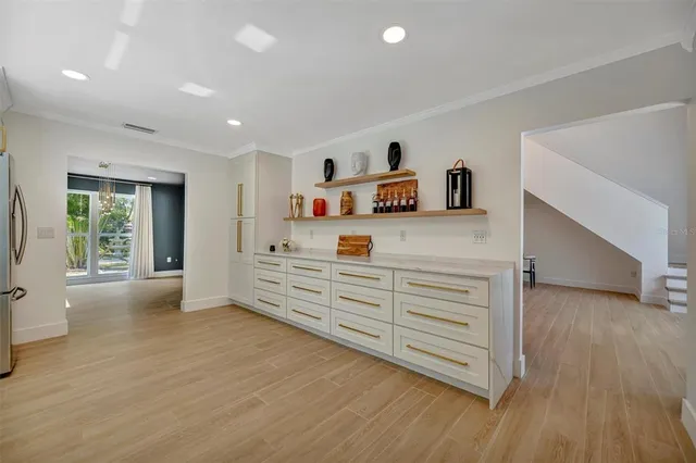 a view of a balcony with wooden floor & fence