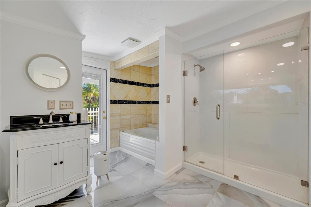 403 Longbow Trail Osprey, FL 34229 - Photo 51 of 99 a kitchen with white cabinets and white appliances