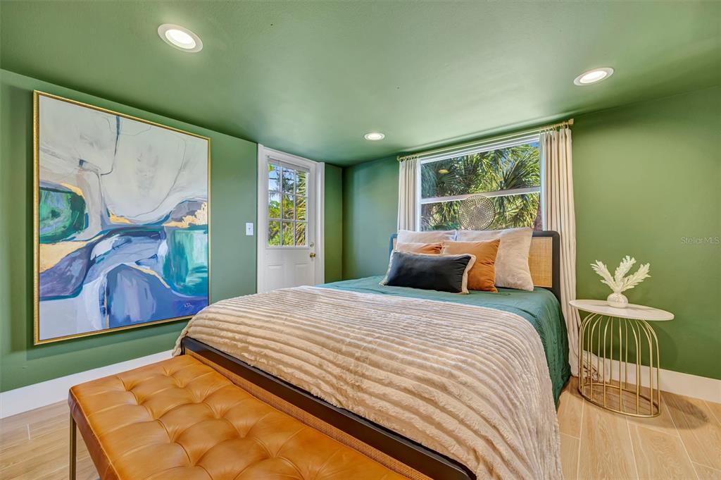 403 Longbow Trail Osprey, FL 34229 - Photo 72 of 99 a bed sitting in a bedroom next to a window
