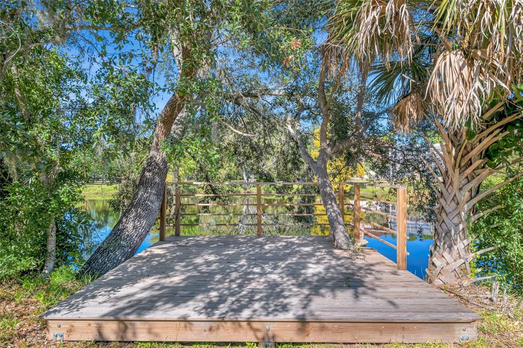 403 Longbow Trail Osprey, FL 34229 - Photo 88 of 99 a view of a yard with plants and trees