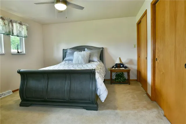 a bedroom with a bed and a view of bathroom