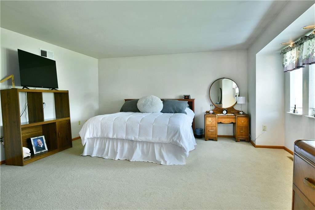 108 Davis Lane Freedom, PA 15042 - Photo 37 of 50 a bedroom with a bed a flat screen tv and dresser