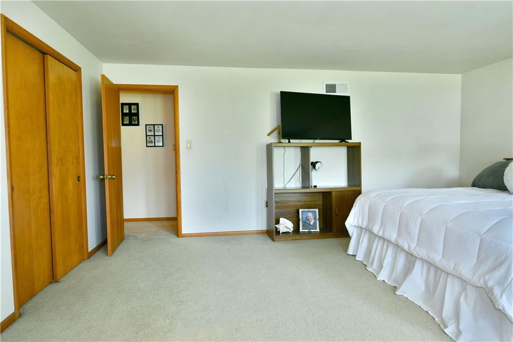 108 Davis Lane Freedom, PA 15042 - Photo 38 of 50 a bedroom with a bed and a flat screen tv