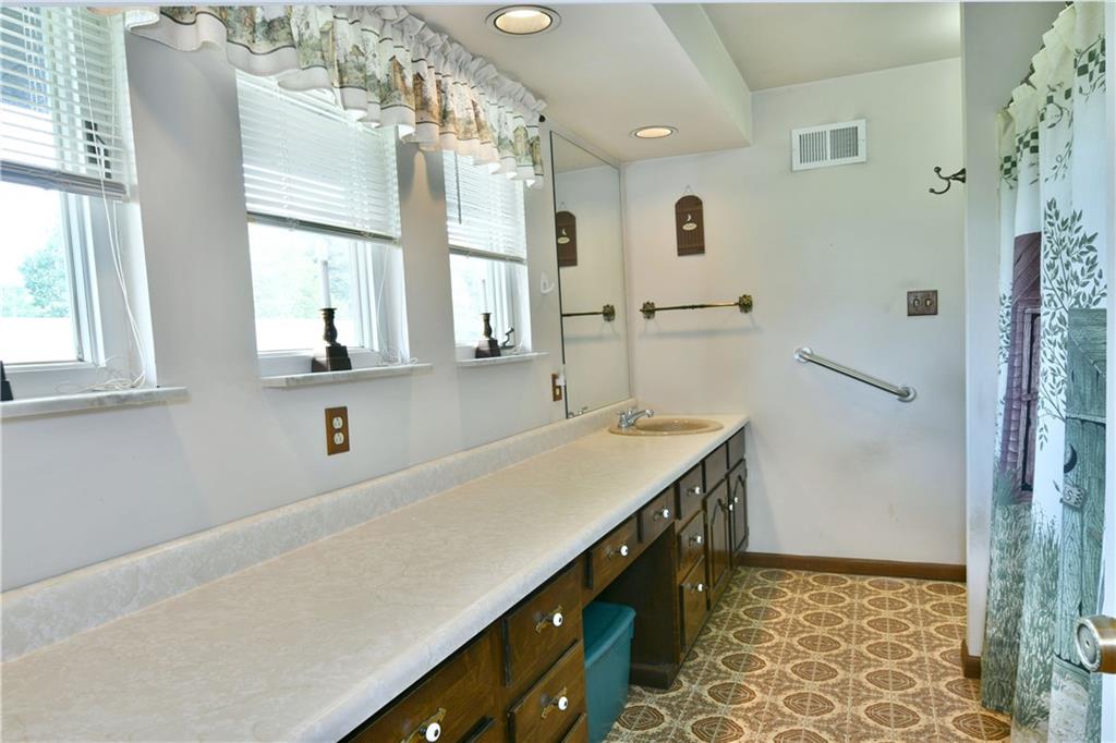 108 Davis Lane Freedom, PA 15042 - Photo 41 of 50 a bathroom with a sink and a mirror
