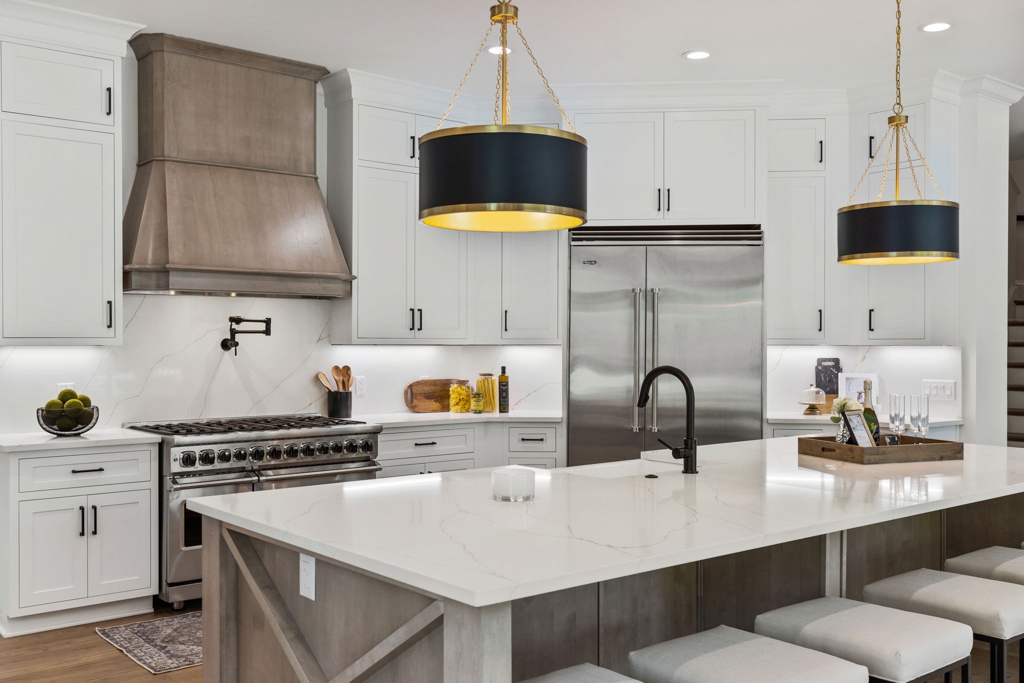9050 Split Log Road Brentwood, TN 37027 - Photo 12 of 69 a kitchen with a sink a stove and a kitchen island