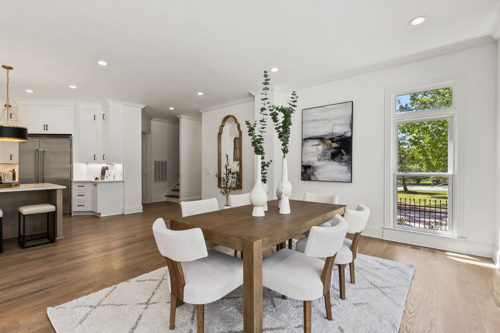 9050 Split Log Road Brentwood, TN 37027 - Photo 19 of 69 a view of a dining room with furniture and wooden floor