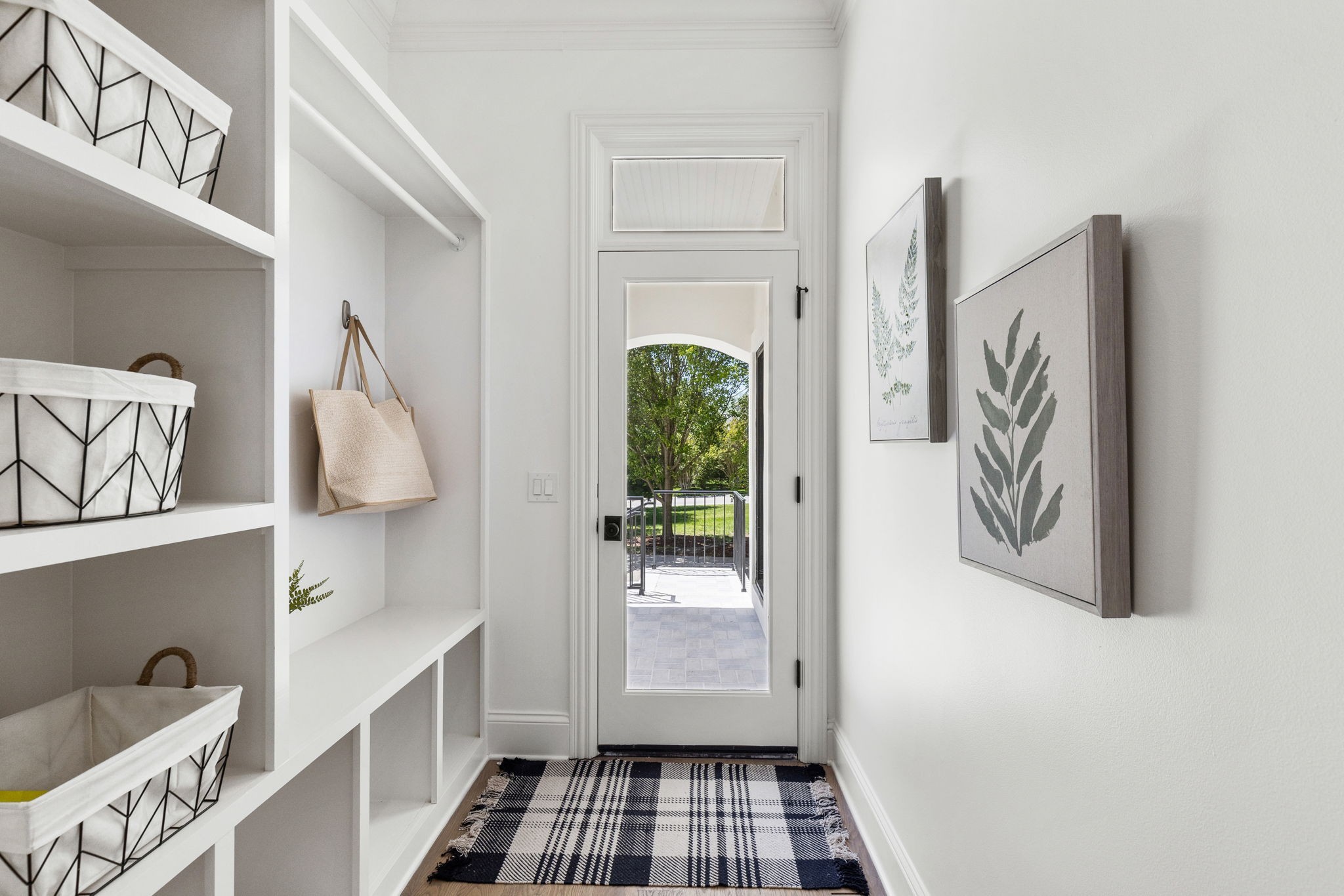 9050 Split Log Road Brentwood, TN 37027 - Photo 39 of 69 a walk in closet with wooden floor washer and dryer