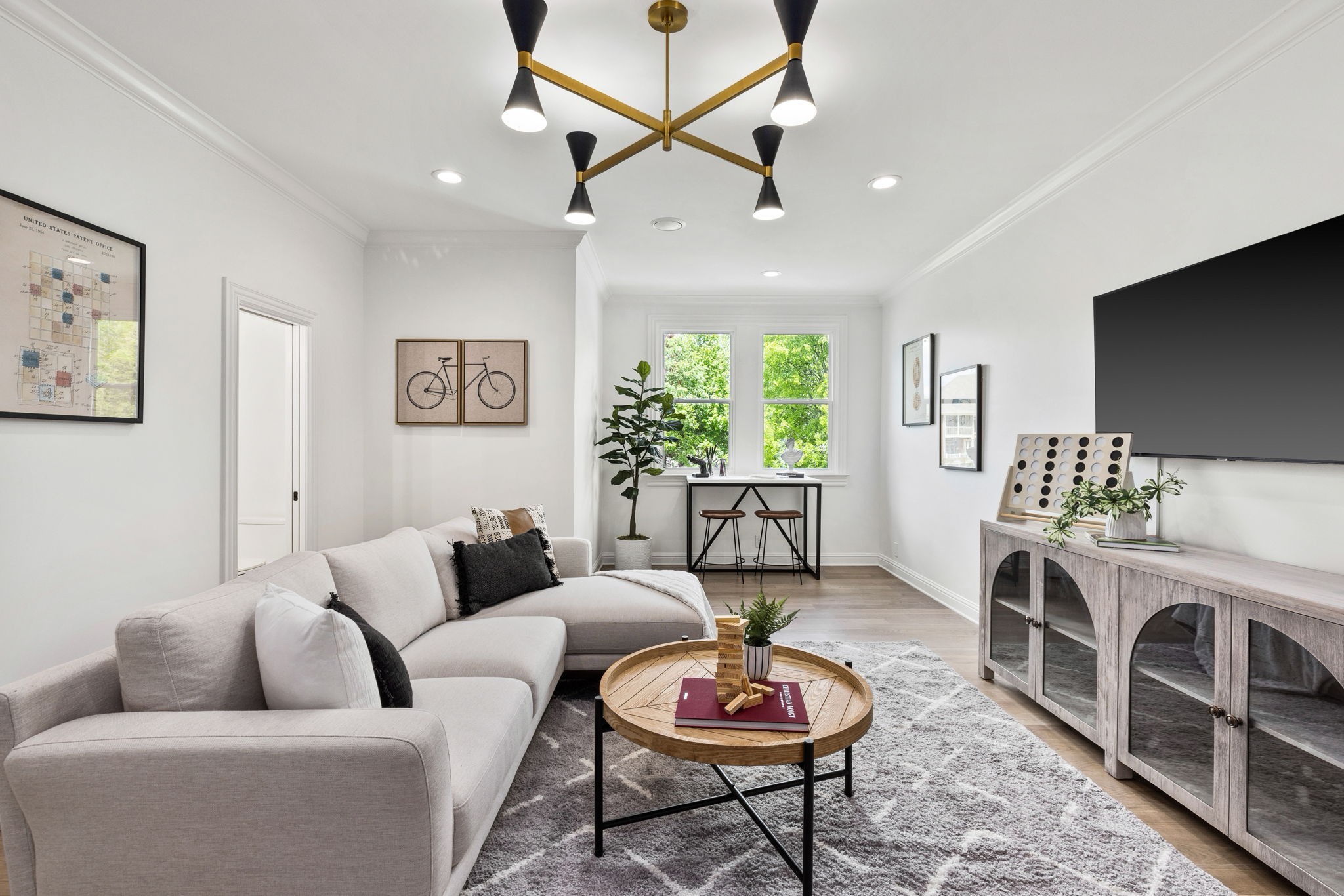 9050 Split Log Road Brentwood, TN 37027 - Photo 44 of 69 a living room with furniture a rug and a flat screen tv