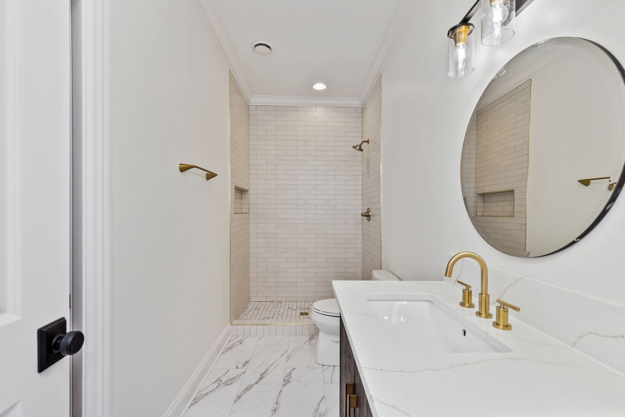 9050 Split Log Road Brentwood, TN 37027 - Photo 47 of 69 a bathroom with a sink a toilet and a mirror