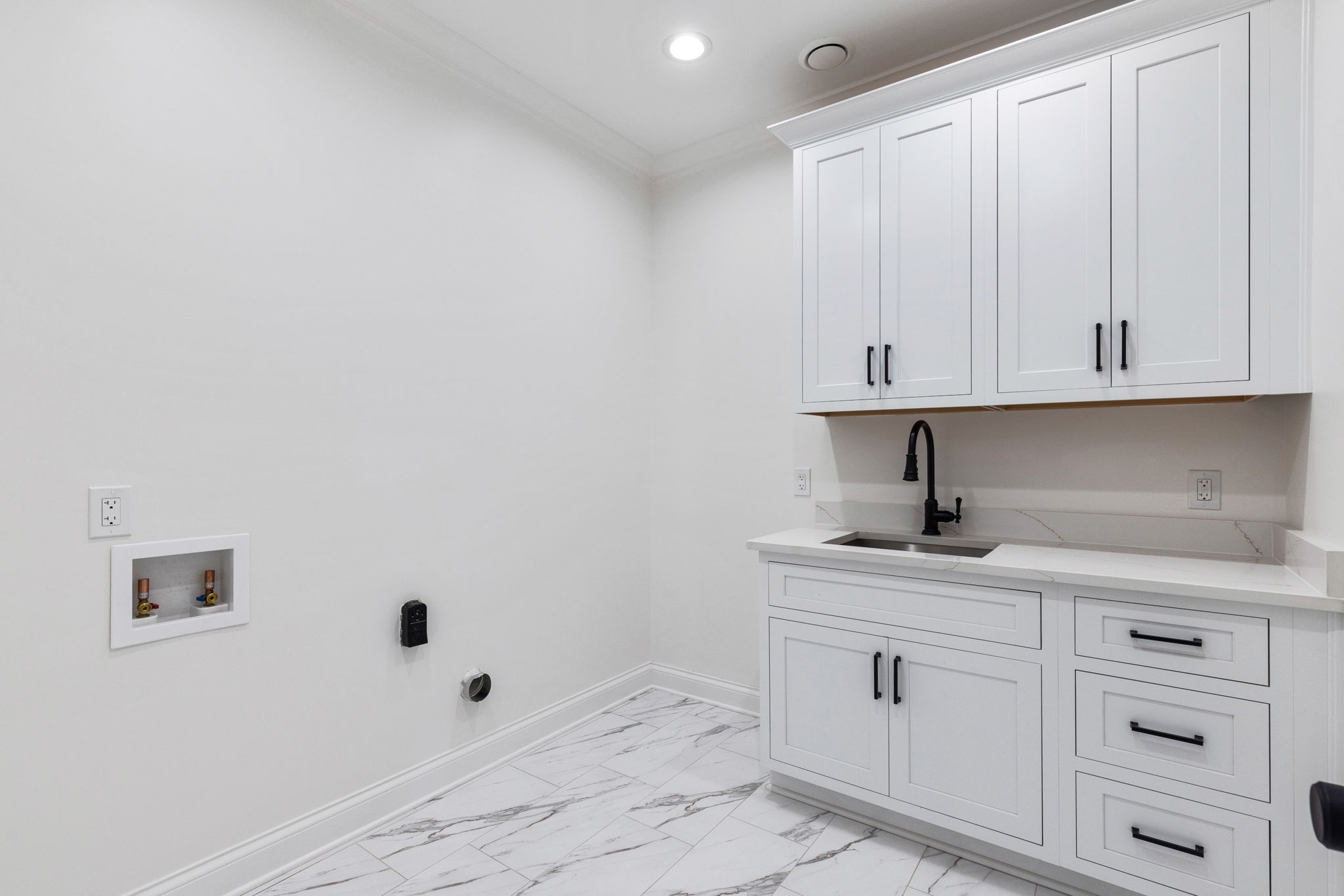9050 Split Log Road Brentwood, TN 37027 - Photo 53 of 69 a kitchen with white cabinets and a sink