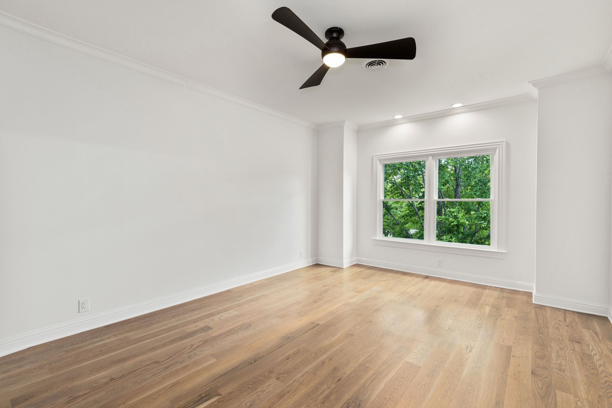 9050 Split Log Road Brentwood, TN 37027 - Photo 57 of 69 an empty room with wooden floor fan and windows