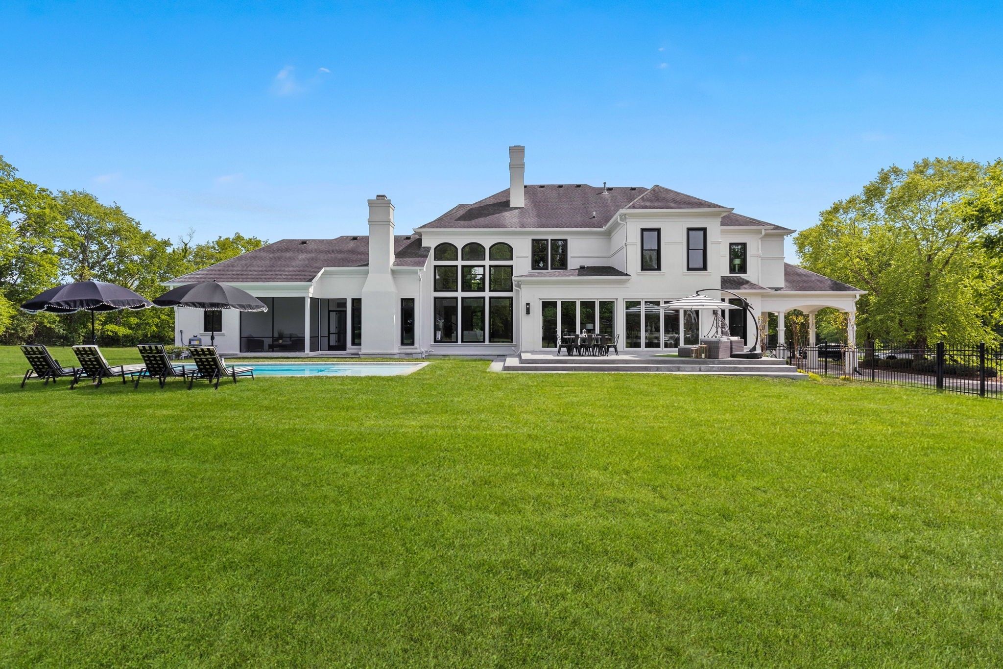 9050 Split Log Road Brentwood, TN 37027 - Photo 61 of 69 a front view of a house with a garden and yard
