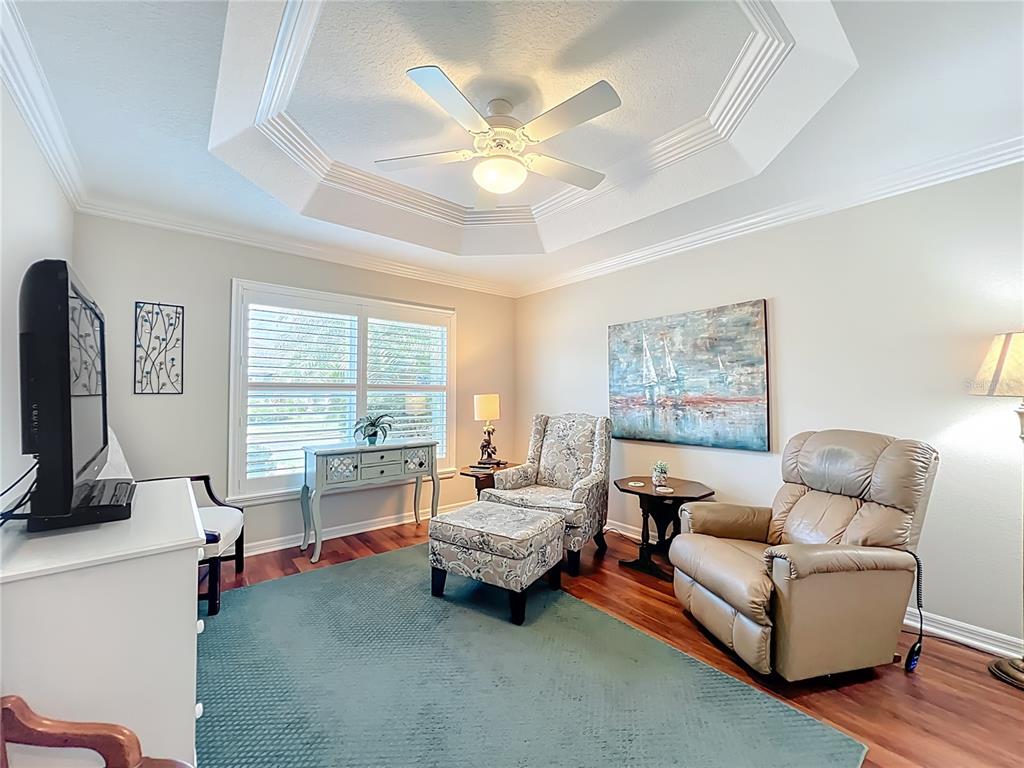 2875 Rain Lily Loop The Villages, FL 32163 - Photo 16 of 36 a living room with furniture and a large window