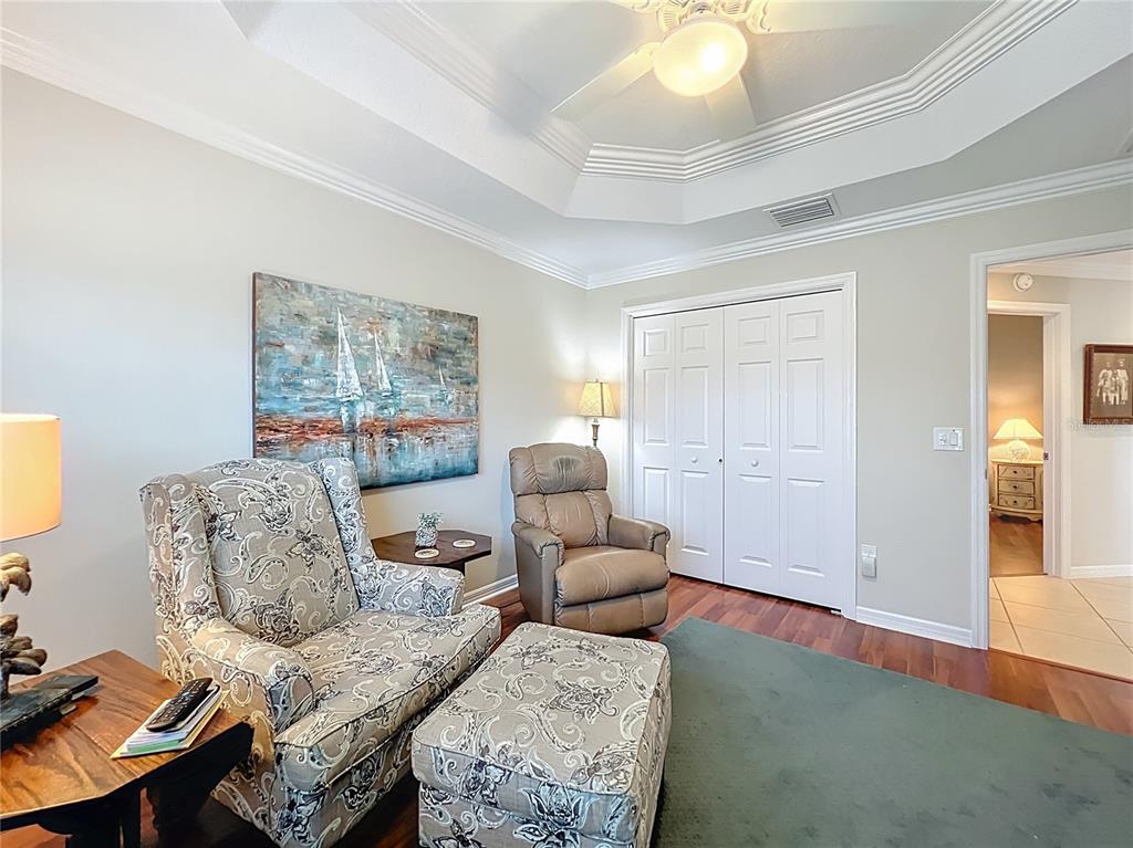 2875 Rain Lily Loop The Villages, FL 32163 - Photo 17 of 36 a living room with furniture and a large window