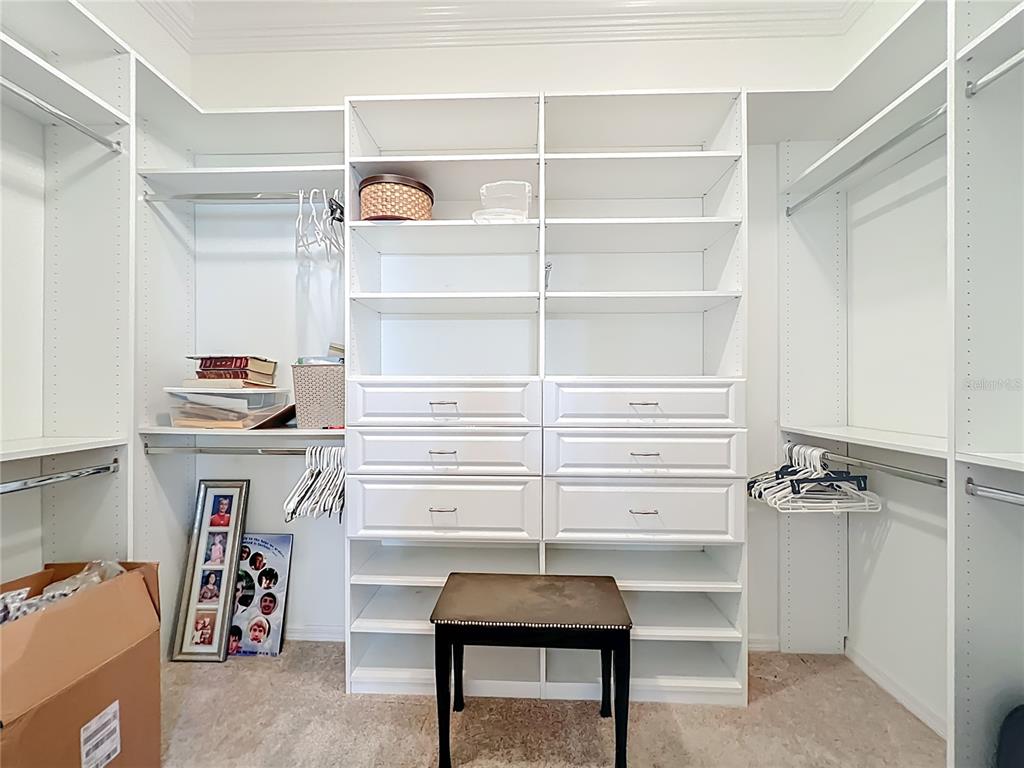 2875 Rain Lily Loop The Villages, FL 32163 - Photo 26 of 36 a view of walk in closet with clothes and shoes