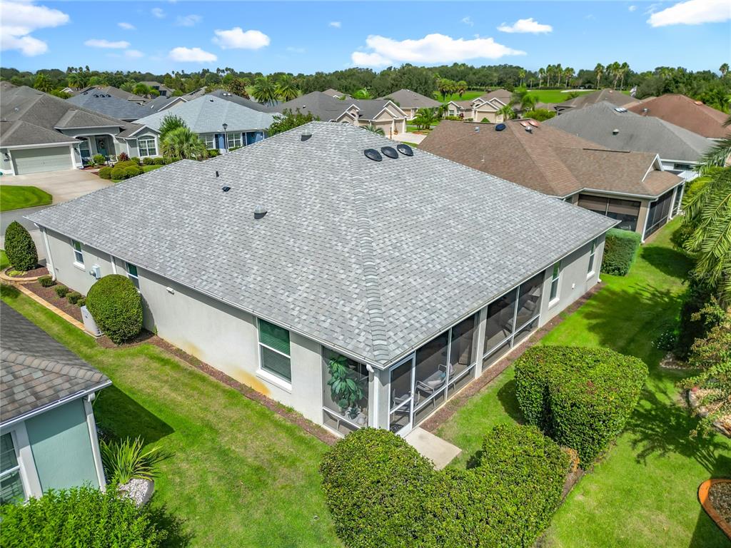 2875 Rain Lily Loop The Villages, FL 32163 - Photo 35 of 36 an aerial view of a house with a garden