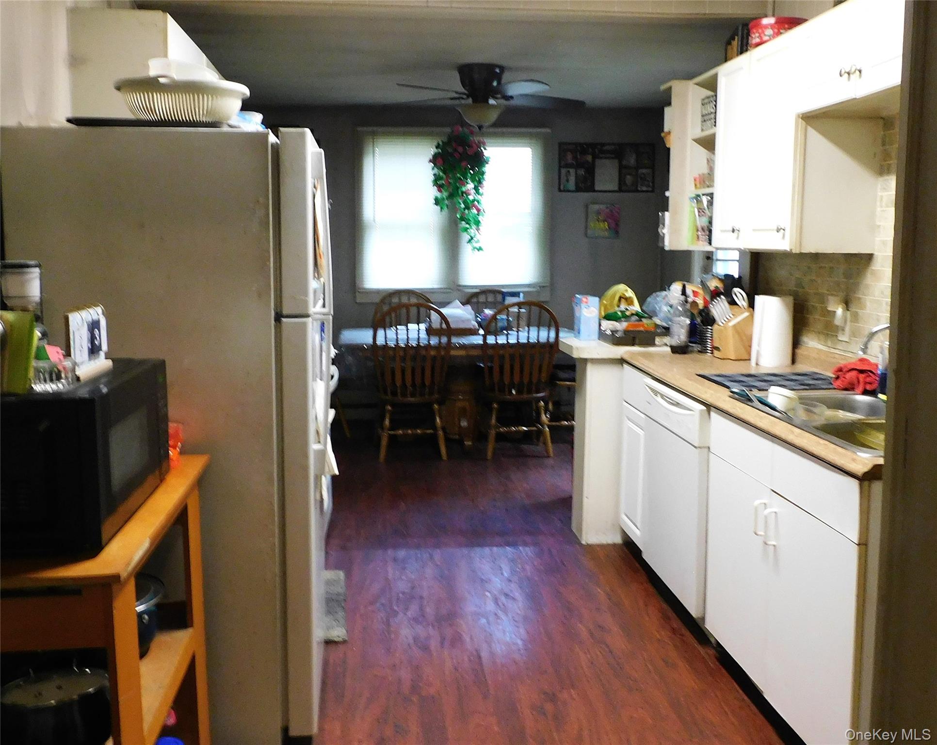 18-20 Church Road Mountain Dale, NY 12763 - Photo 19 of 20 a kitchen with sink cabinets and wooden floor