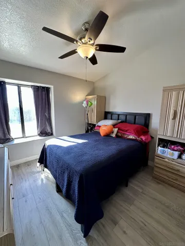 a bedroom with a bed and window