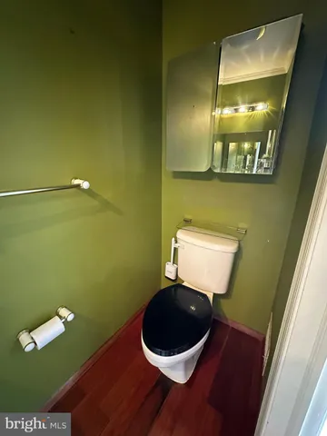 a bathroom with a toilet and a sink