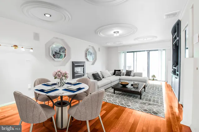 a living room with furniture kitchen and a window