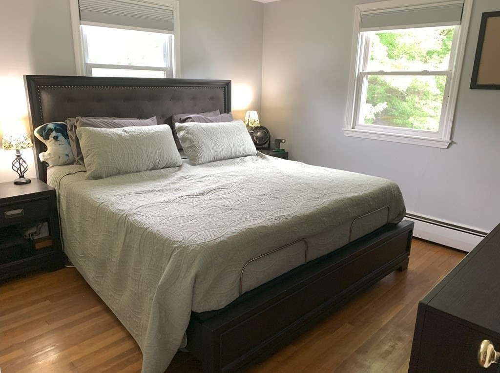 12 Garnet Road Billerica, MA 01821 - Photo 6 of 12 a bed sitting in a bedroom next to a window