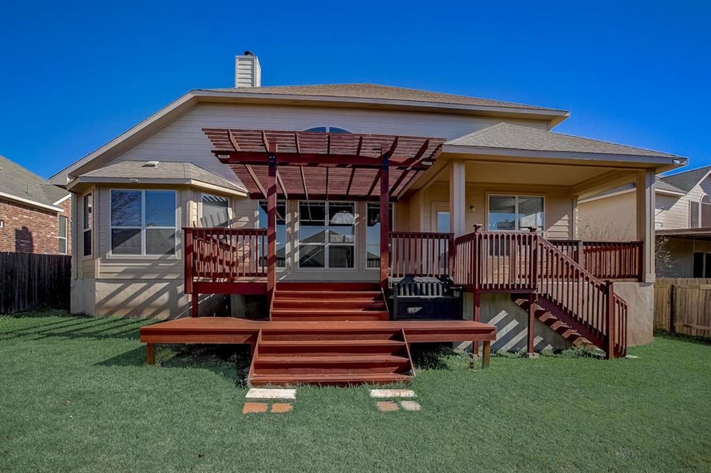 3604 Rams Horn Way Round Rock, TX 78665 - Photo 5 of 26 A spacious backyard with a multi-level deck, perfect for entertaining or relaxing.