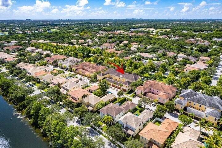 207 Edenberry Avenue Jupiter, FL 33458 - Photo 12 of 16 an aerial view of residential houses with outdoor space and trees