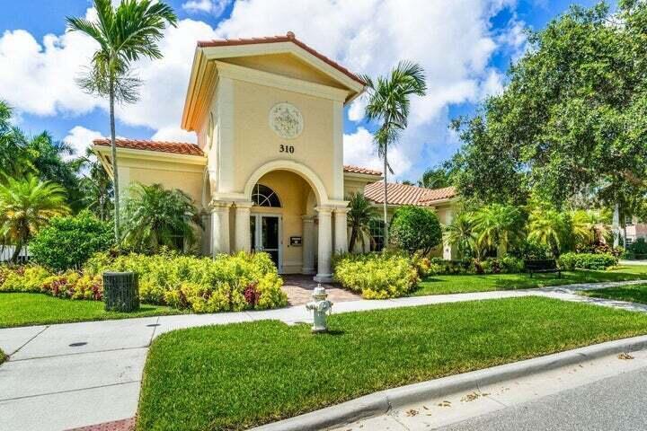 207 Edenberry Avenue Jupiter, FL 33458 - Photo 13 of 16 a front view of a house with garden