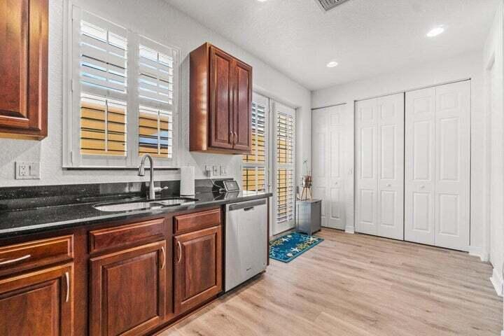207 Edenberry Avenue Jupiter, FL 33458 - Photo 4 of 16 a kitchen with a sink stove and cabinets