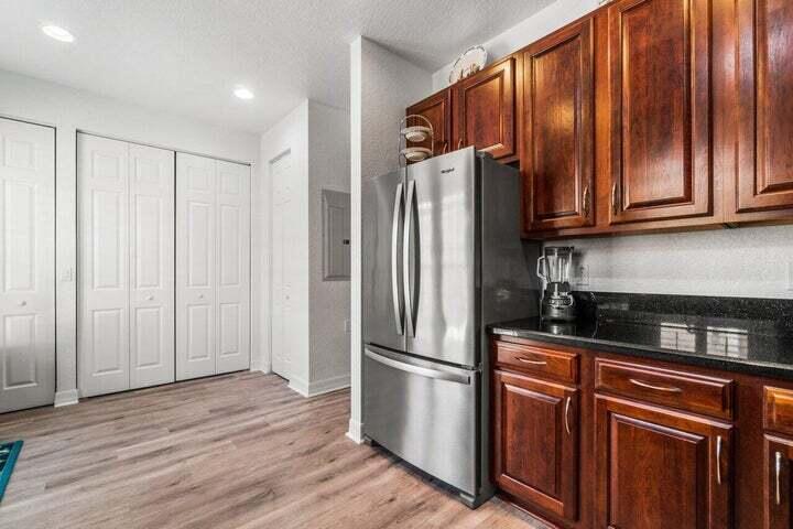 207 Edenberry Avenue Jupiter, FL 33458 - Photo 5 of 16 a kitchen with stainless steel appliances granite countertop a refrigerator and a sink