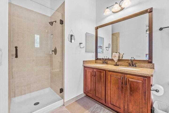 207 Edenberry Avenue Jupiter, FL 33458 - Photo 6 of 16 a bathroom with a shower sink and mirror