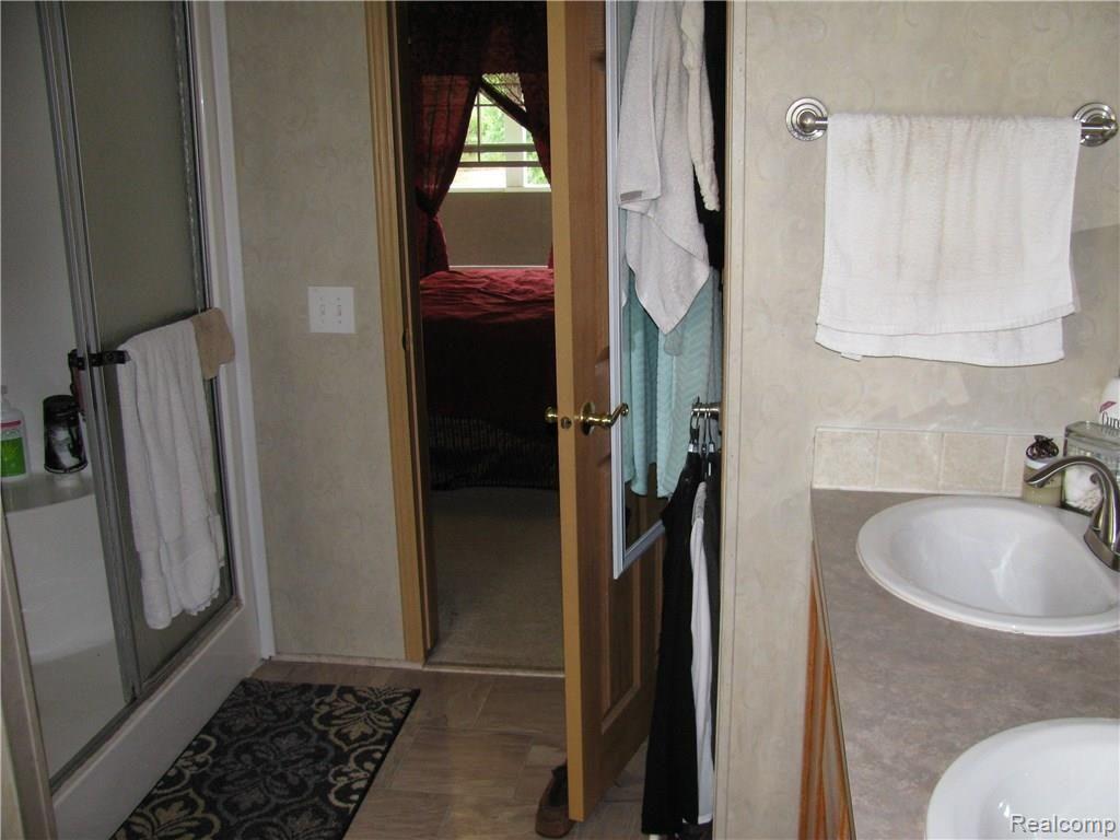 6045 Patrick Road North Branch, MI 48461 - Photo 19 of 44 Master bathroom with double sinks